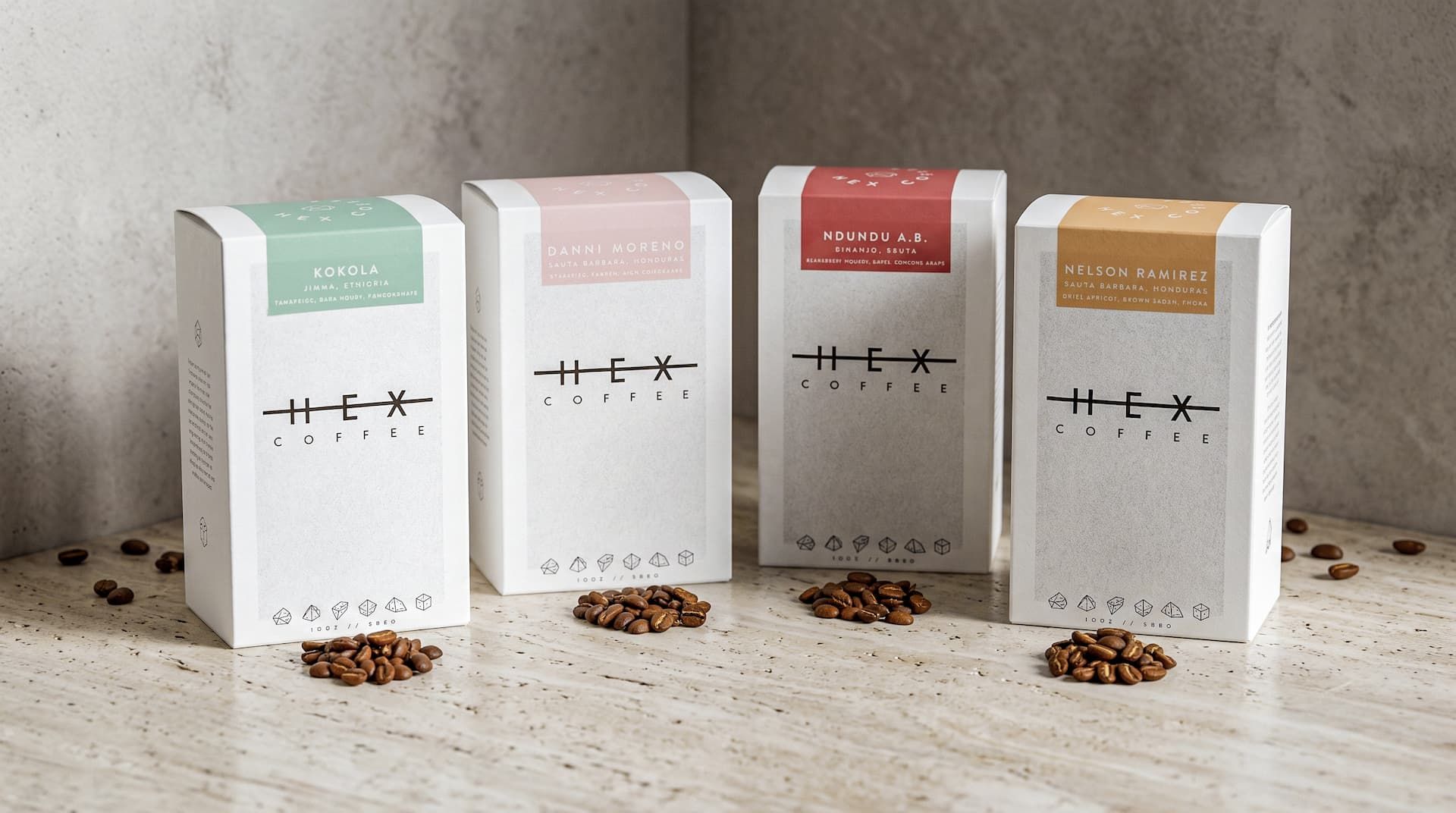 Five white Hex Coffee boxes with colored labels and a burlap sack spilling coffee beans on a wooden table.