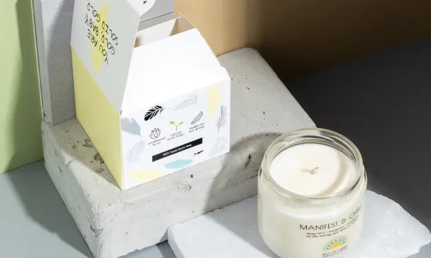 Candle packaging with a glass container