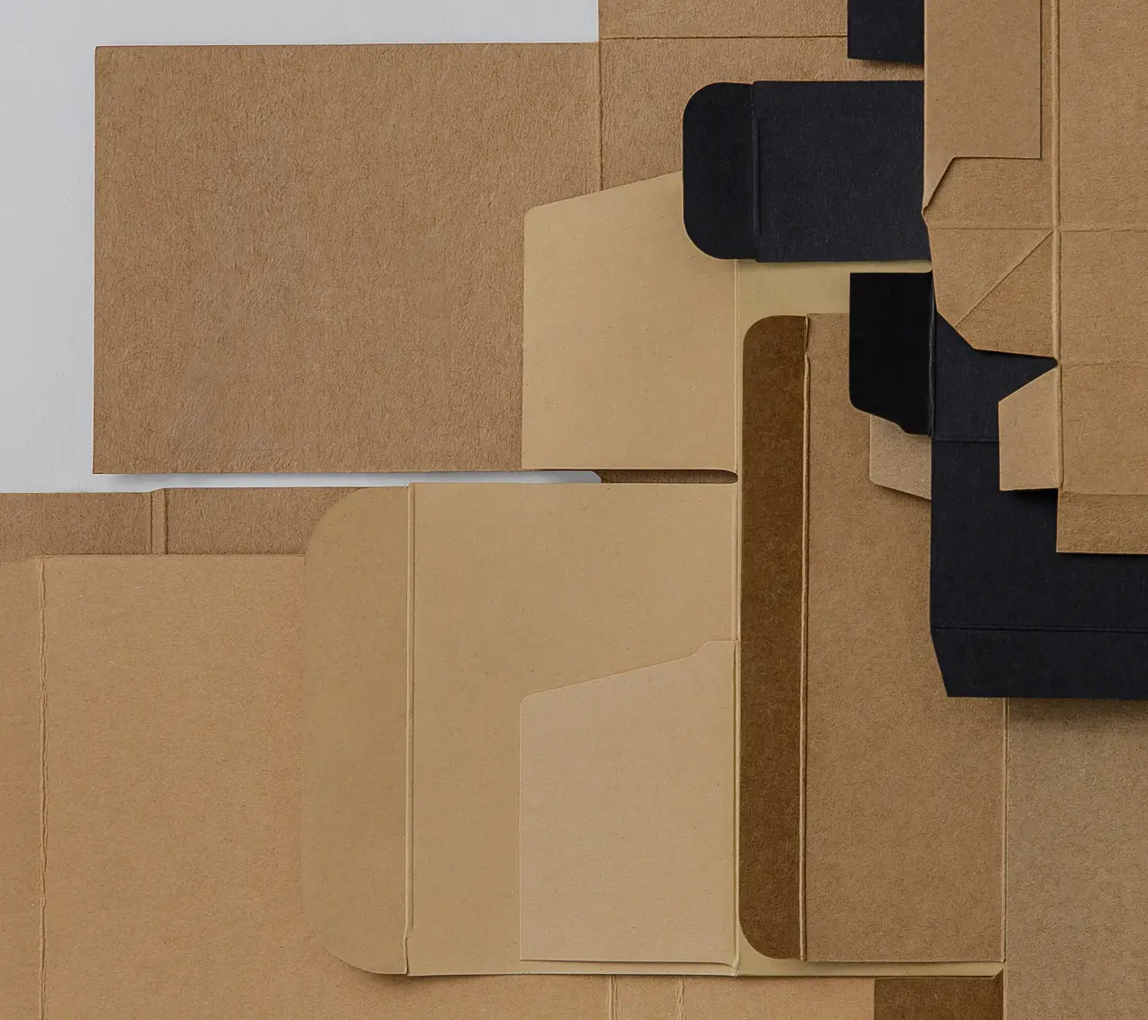 Flat paperboard packaging blanks