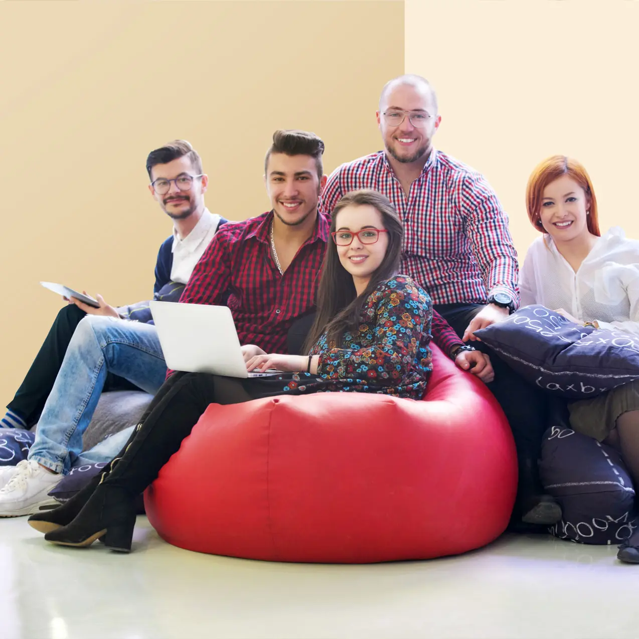 Workplace reference: a group collaborating around a laptop
